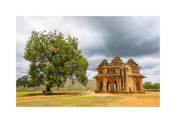 Lotus Mahal Splendor: Architectural Beauty with Majestic Tree in Hampi, Karnataka