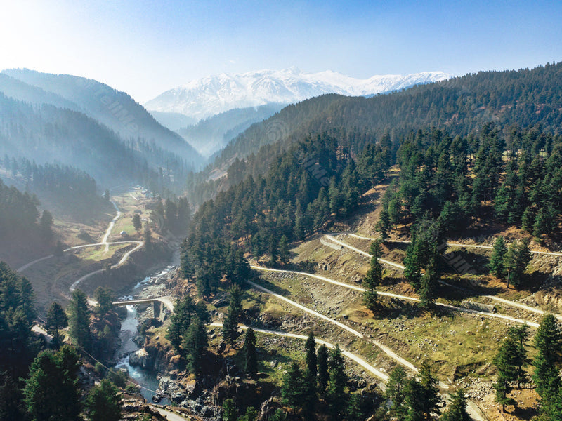Panoramic view of the beautiful Veshu River, a tributary of the Jehlum River, Pine trees and the Aharbal Valley in Kashmir, India