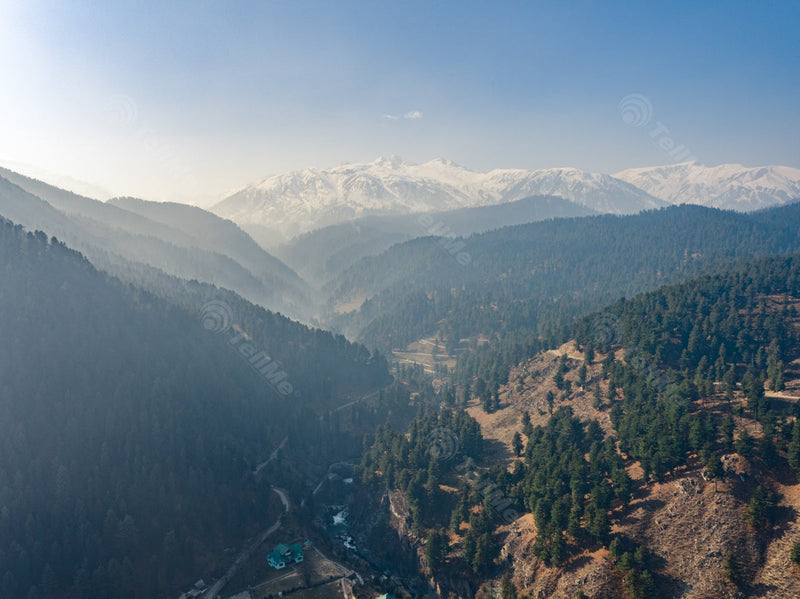 Glacial Peaks and Forested Valleys: A Panoramic View in Aharbal valley in Kashmir, India