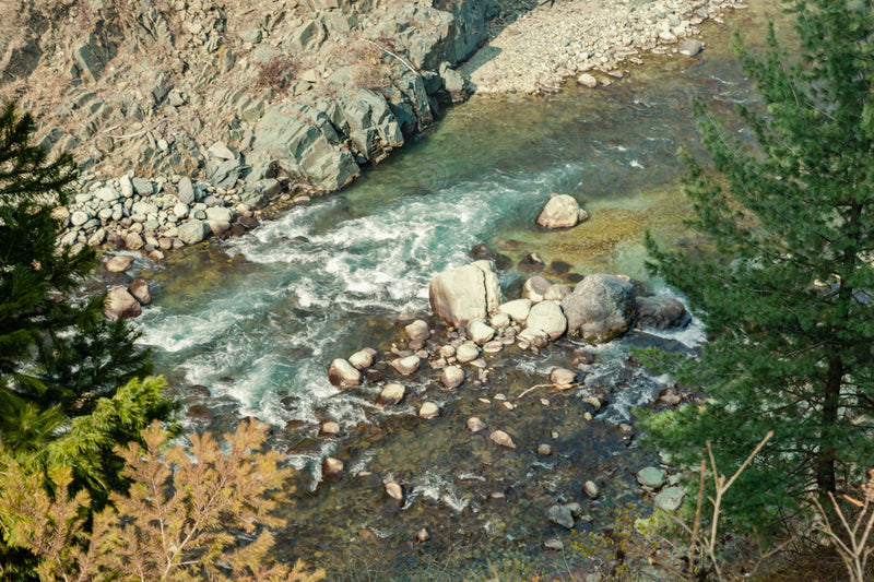 Up Close: Aharbal Valley's Splashing River Stream Amidst Rocks in Kashmir, India