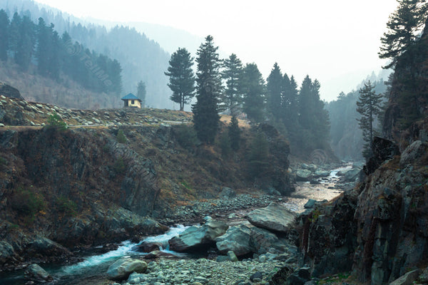 Flowing Majesty: A Scenic View of River and Rocks - Aharbal valley in Kashmir, India