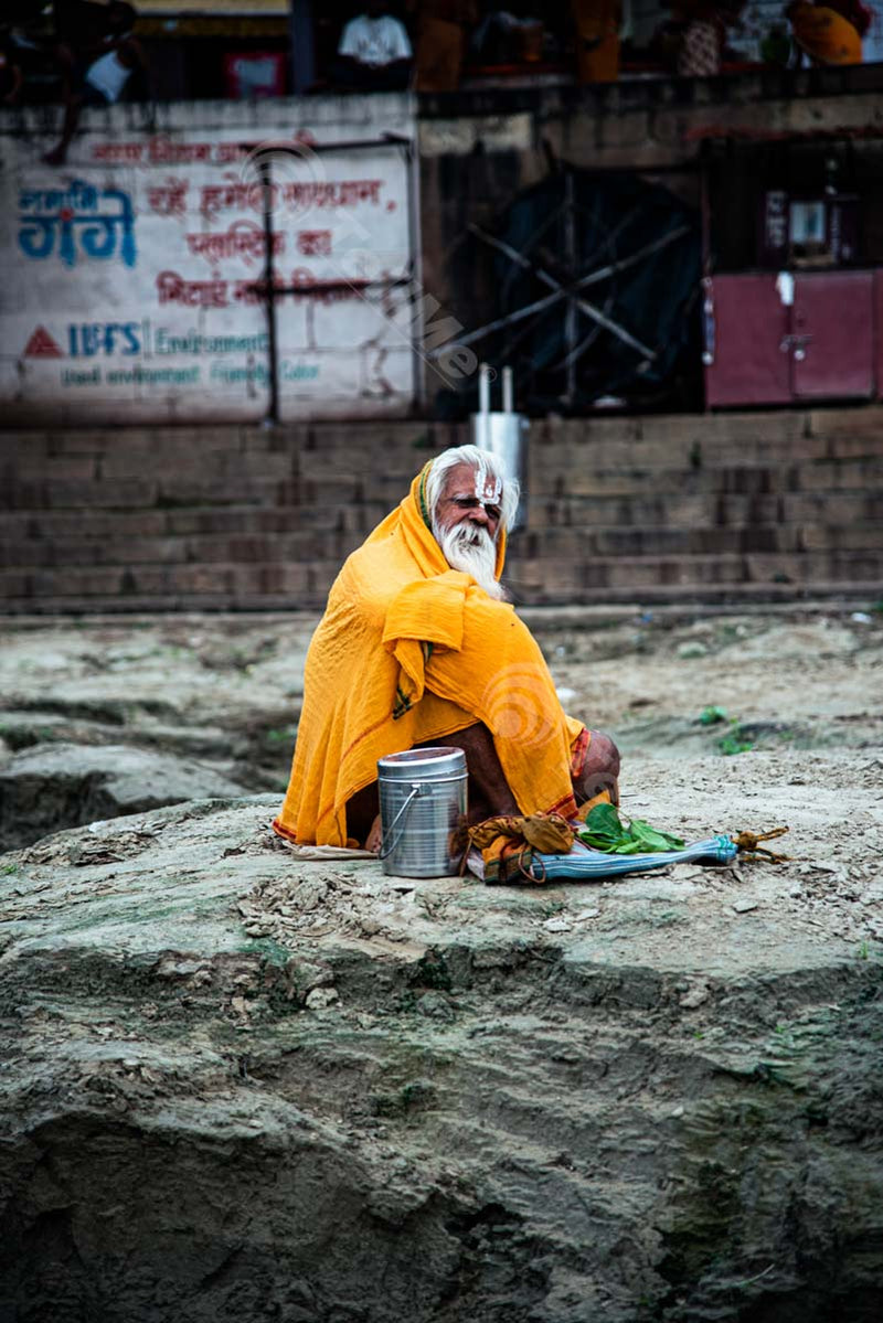 Relaxing Holy Man at Assi Ghat, Banaras in Uttar Pradesh