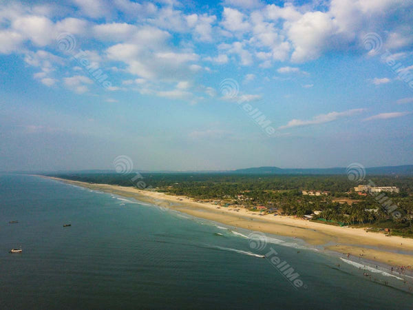 Enchanting Colva: A Panoramic Vista of Goa's Beach, Trees, Resorts, and Tourists