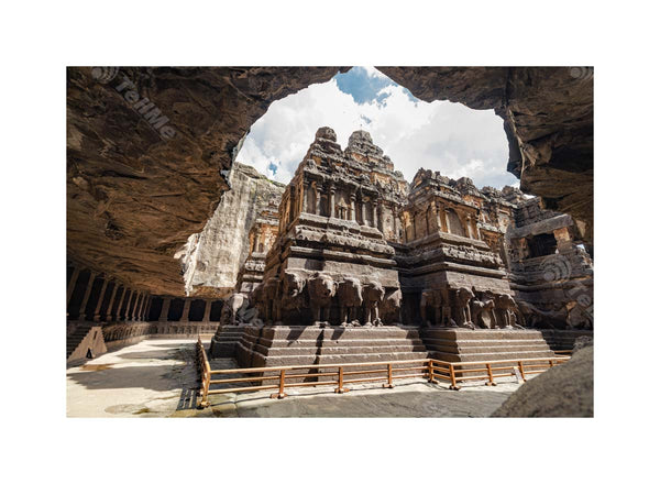 Sunny sky with clouds and Historic Grandeur of Kailasa Temple in Ellora Caves, Aurangabad, Maharashtra"