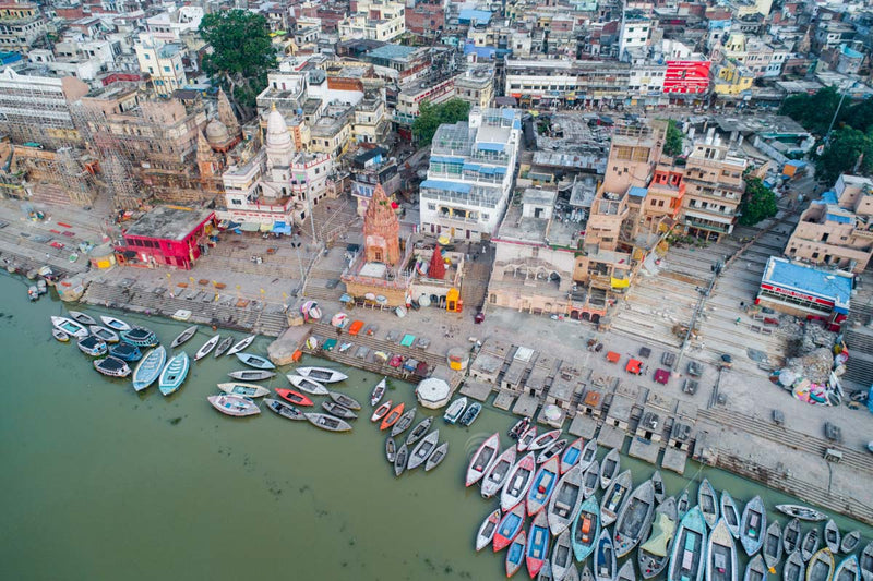 Assi Ghat Aerial View: Boats, Temples, and Pilgrims in Varanasi, Uttar Pradesh