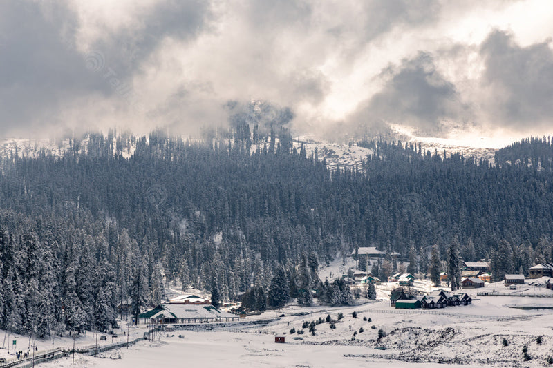 Cloudy Winter Scene: Mountains, Pasture, Trees, and Resorts in Gulmarg, Kashmir, India