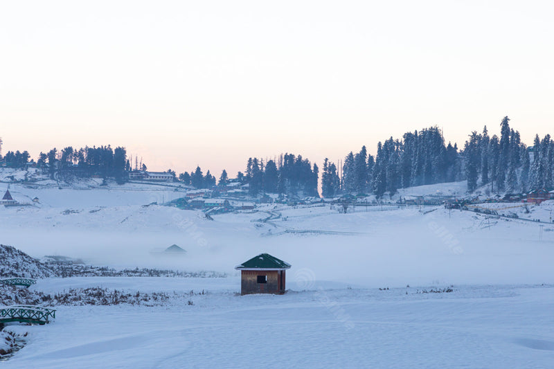 Captivating view of snow covered Temple, a hut, bridges and Scenic Surroundings in Gulmarg, Kashmir, India