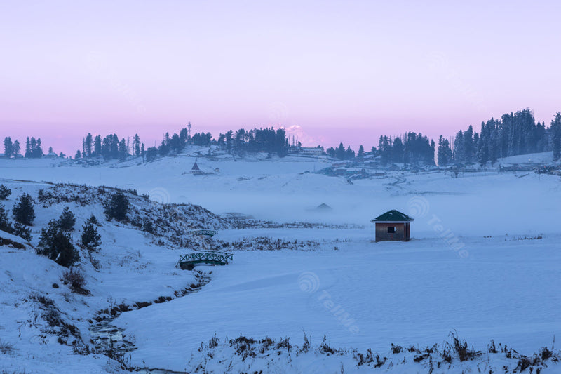 Mesmerizing Winter evening of Gulmarg Scenic view: Snowy Resorts and Pink Mountains in Kashmir, India