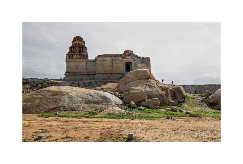 Enormous boulders strewn near the ruins of a temple in Hampi, Karnataka