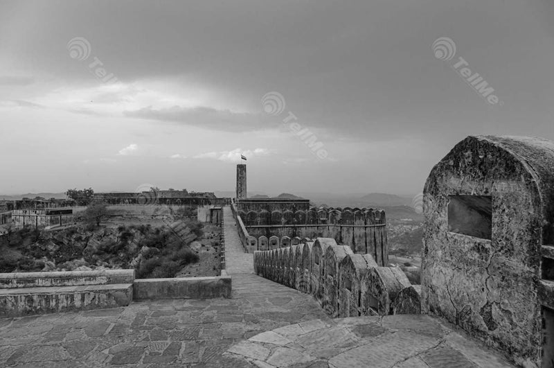 Monochromatic Splendor: Jaigarh Fort's Tower, Showcasing Rajasthan's Cityscape, Majestic Mountains, and the Proud Indian Flag