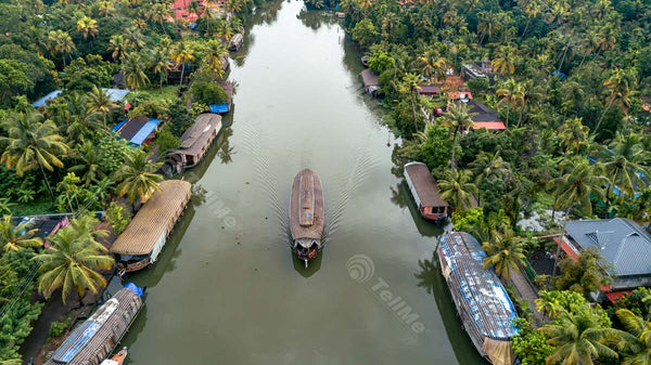 Kumarakom Backwaters: Serene Vistas of Vembanad Lake, Floating Boat, Coconut Trees, and Village