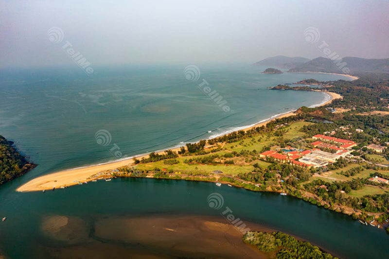 Aerial Serenity: Rajbaga Beach in Goa, Resorts, and Moored Boats