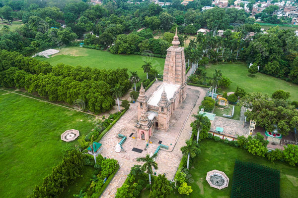 Experience a Unique Drone View of Sarnath Temple, Set Amidst Lush Green Trees and Man-made Lawn in Varanasi, Uttar Pradesh