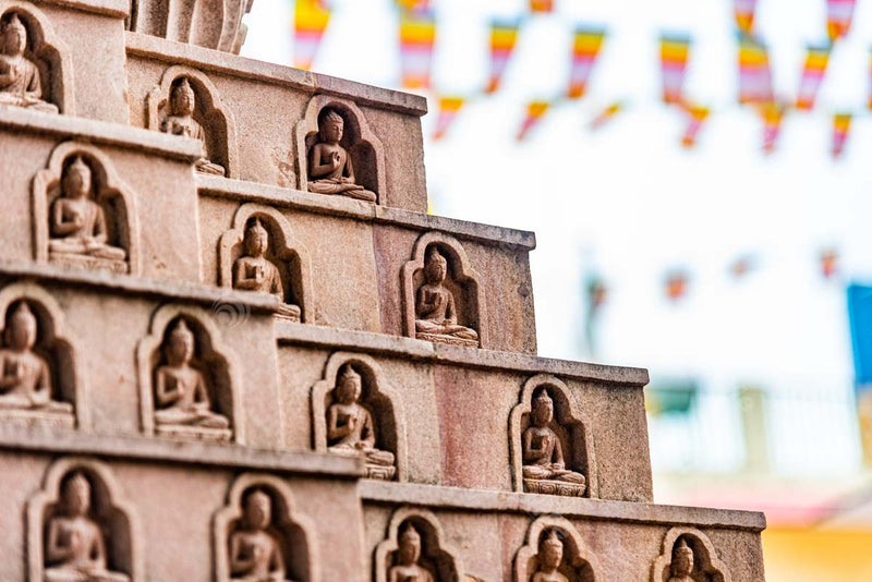 Stunning Stone Carvings: Lord Buddha Idols at Sarnath Tibetan Temple